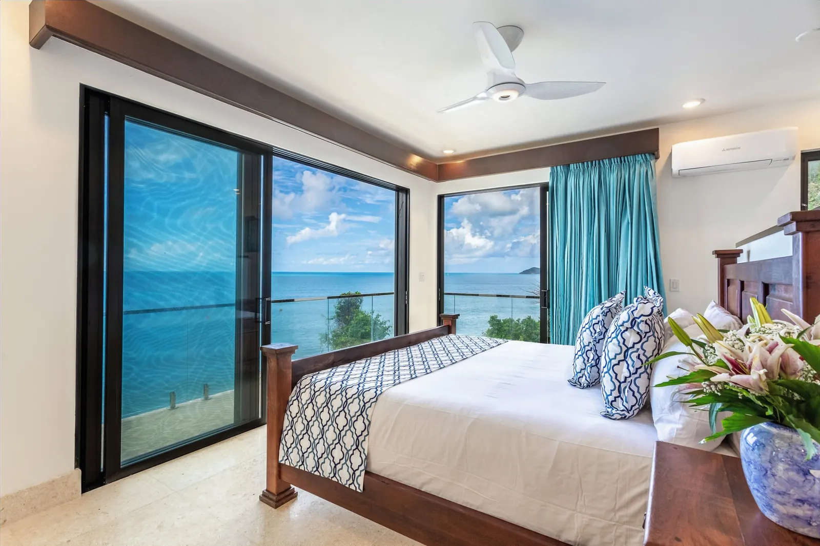 Bedroom with ocean view at the M@M Cooper Bay Villas