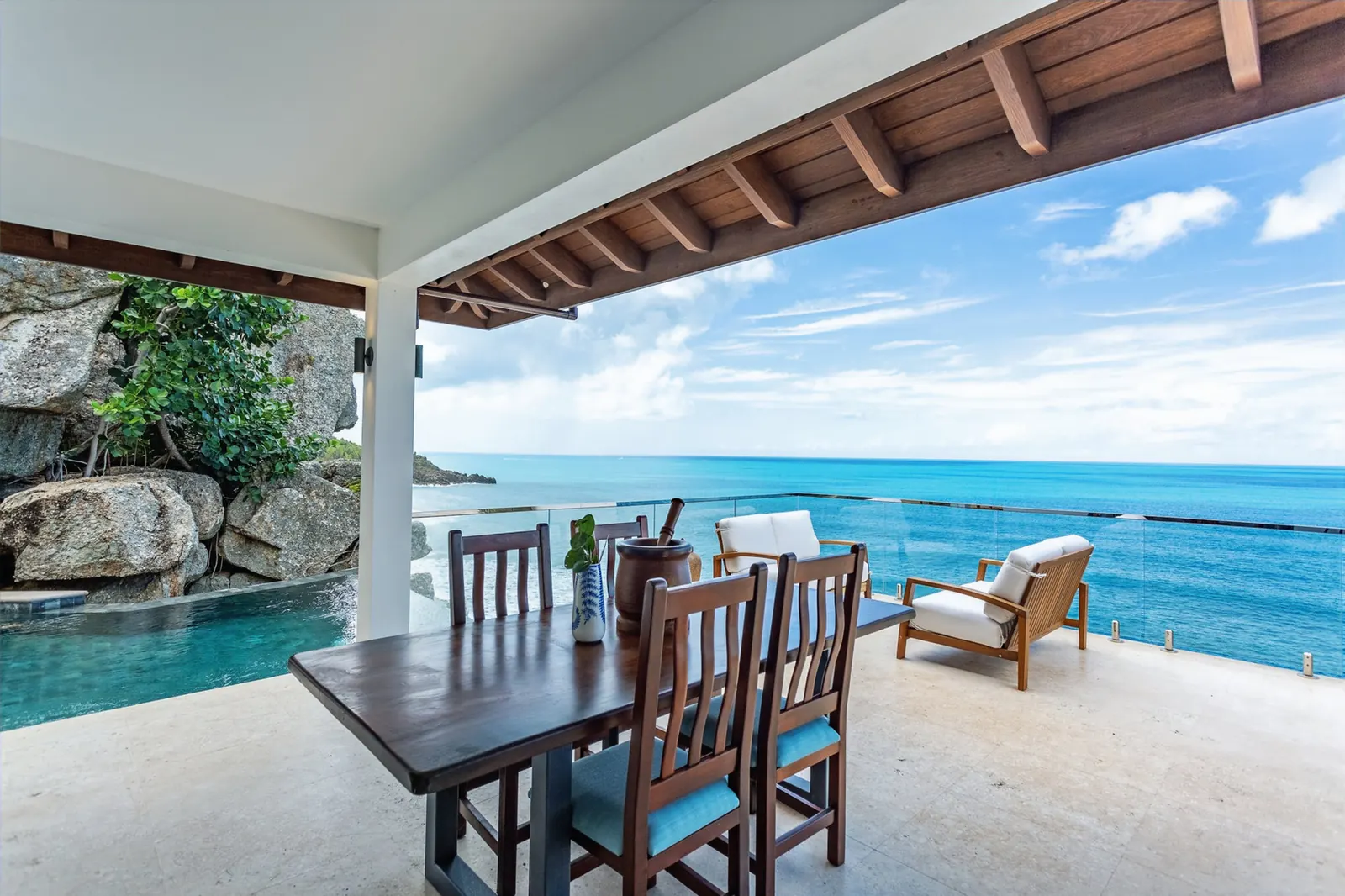 Ocean-view dining terrace at the M@M Cooper Bay Villas