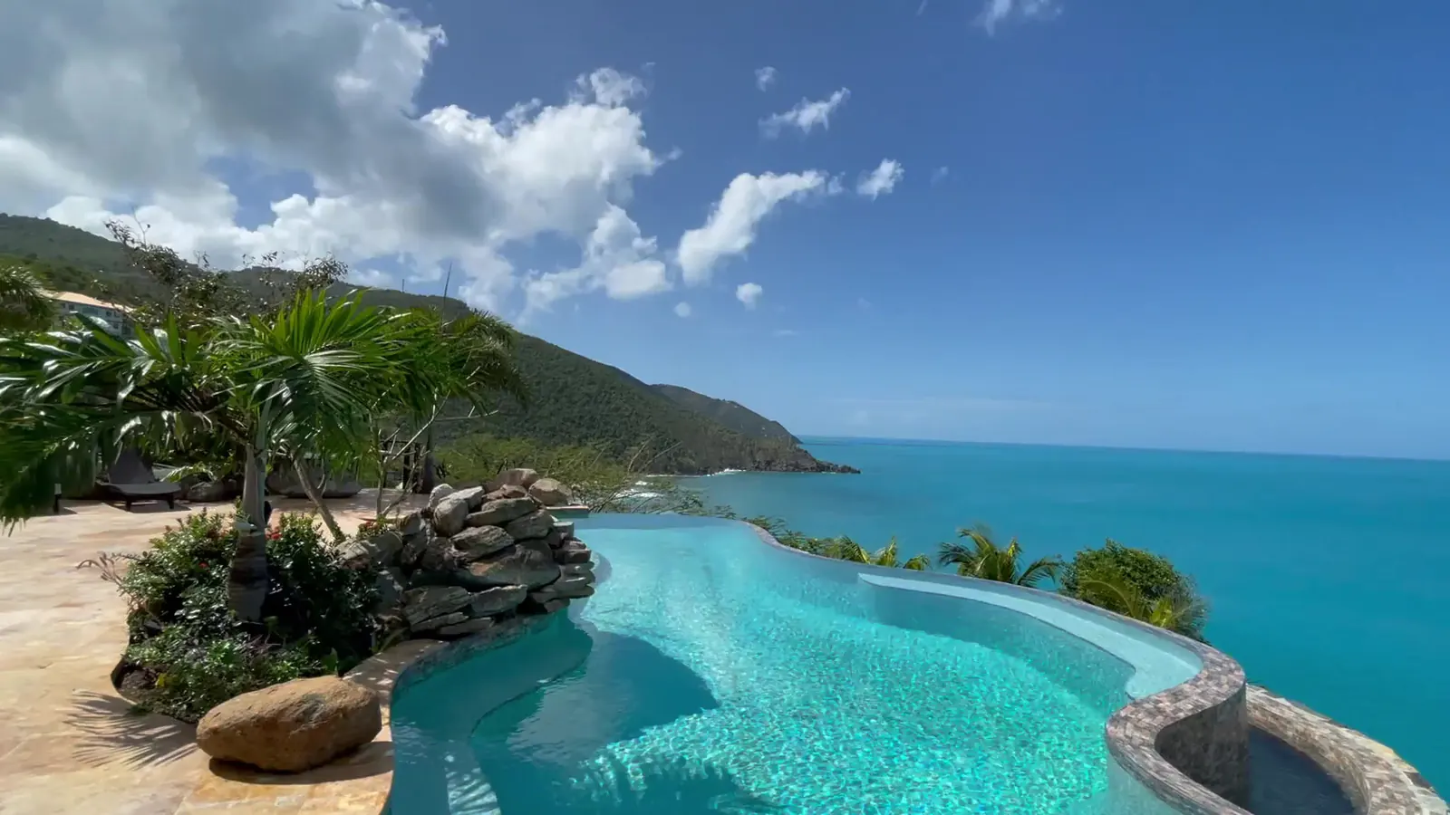 Infinity pool of Villa MyALL Tortola at sunset above the Caribbean Sea, Tortola